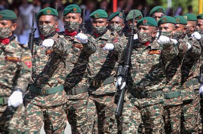 Soldiers parade to mark the twentieth anniversary of East Timor's independence from Indoneasia in 2002. East Timor is due to join Asean this weekend. EPA