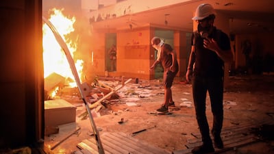 Protesters light fires inside the Lebanese Banks Association (ABL) headquarters during a demonstration. Bloomberg