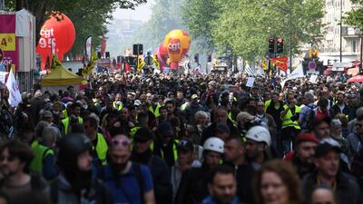 People take part in the annual May Day (Labour Day) workers' demonstration in the Montparnasse district of Paris on May 1, 2019. AFP