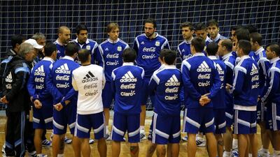 The Argentina national football team gather in a circle on the hardcourt of Bucharest's Polyvalent Hall after their training session ahead of an international friendly against Romania. Robert Ghement / EPA