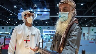 Marksman Ali Mohammat Al Shehhi, right, at Adihex. Victor Besa / The National