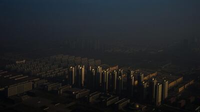 In this image released by World Press Photo titled “Haze in China” by photographer Zhang Lei which won the first prize in the Contemporary Issues Singles category shows a city in northern China shrouded in haze, Tianjin, China, Dec. 10, 2015. Zhang Lei / Tianjin Daily, World Press Photo via AP