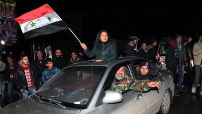 Syrians celebrate on December 22, 2016 in the northern Syrian city of Aleppo, after the army said it has retaken full control of the country's second city The army said it has retaken full control of Syria's devastated second city Aleppo, scoring its biggest victory against opposition forces since the civil war erupted in 2011. George Ourfalian / AFP