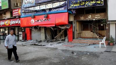 A man walks at one of the sites of bombings in Cairo on February 27. EPA