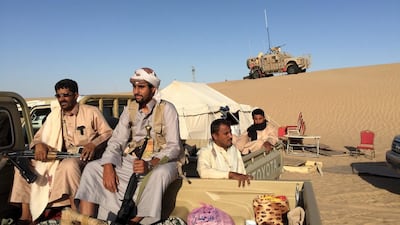 Armed Yemeni tribesmen sit in the back of a pickup truck in Marib, where they are fighting alongside Yemeni troops and soldiers from the Gulf against Houthi rebels. Noah Browning / Reuters