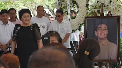 Philippines' former first lady Imelda Marcos speaks to supporters at the graveyard of the late dictator Ferdinand Marcos at the national heroes' cemetery in Manila on November 19, 2016, a day after the late president was buried. Ex-Philippine dictator Marcos was buried in a secretive ceremony at the national heroes' cemetery November 18, triggering street protests as opponents denounced what they said was the whitewashing of his brutal and corrupt rule. / AFP / Ted ALJIBE