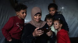 Huda Abu Jazar, centre, is the mother of Palestine manager Ihab Abu Jazar. AFP