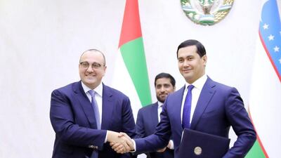 Mohamed Jameel Al Ramahi, chief executive of Masdar, and Sardor Umurzakov, minister of investments and foreign trade of Uzbekistan after signing the new deal. Supplied by Masdar