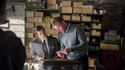 Henry Cavill and director Guy Ritchie, right, on the set of The Man from U.N.C.L.E. Daniel Smith / Warner Bros Pictures