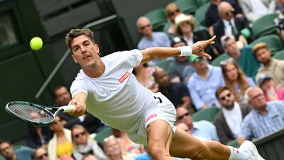 Australia's Thanasi Kokkinakis returns the ball to Novak Djokovic. AFP