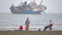 Iranians sit on Suru Beach in Bandar Abbas along the Strait of Hormuz. AFP