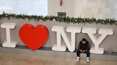 A passenger waits for a flight at LaGuardia Airport in New York. AFP