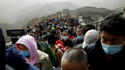 Visitors wearing masks, following the Covid-19 outbreak, crowd the Badaling section of the Great Wall in Beijing, China. Reuters