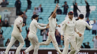 England's James Anderson, centre, bowled Mohammed Shami for his 564th Test wicket. AFP