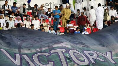 Al Nasr fans display a 'victory' banner during the Arabian Gulf Cup final. Pawan Singh / The National