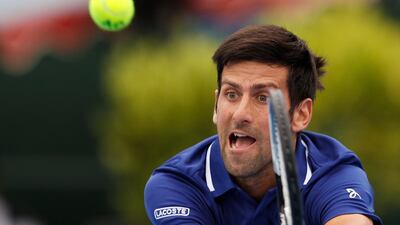 Novak Djokovic of Serbia plays a backhand against Dominic Thiem of Austria in the 2018 Kooyong Classic. Daniel Pockett / Getty Images