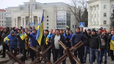 Ukrainians shout at Russian army soldiers during a rally against the occupation of Kherson. AP