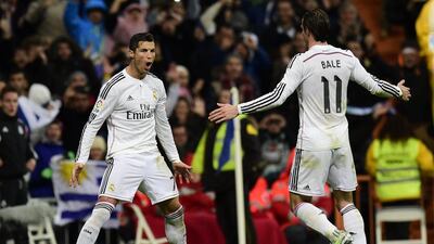 Real Madrid's Cristiano Ronaldo celebrates one of his three goals with teammate Gareth Bale on Saturday during their La Liga win over Celta Vigo. Javier Soriano / AFP