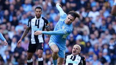 City's Jack Grealish is challenged by Newcastle midfielder Bruno Guimaraes. PA