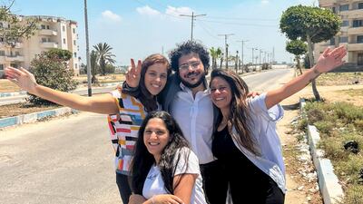 Patrick Zaki celebrates his release with his family on Thursday outside the Dakahlia security headquarters in Mansoura. AP