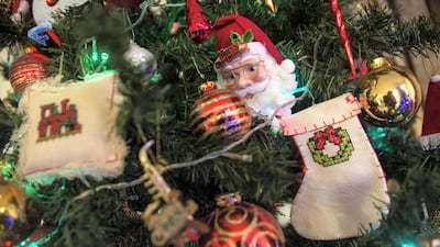 Handmade Christmas decorations on the tree of Azzam at their home .