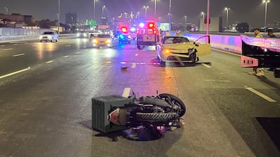 Police and emergency workers at the scene of the crash on Umm Suqeim Road. Photo: Dubai Police