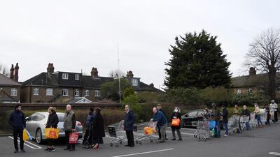 Shoppers queue to enter a Sainsbury's supermarket in West London. Reuters