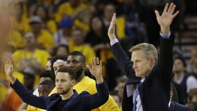 Golden State Warriors guard Stephen Curry, left, celebrates during the team's Game 1 win over the Portland Trail Blazers. Marcio Jose Sanchez / AP / May 1, 2016