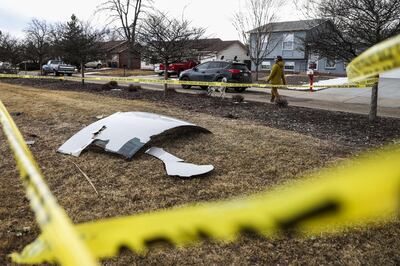 Pieces of an airplane engine from Flight 328 sit scattered in a neighbourhood in Broomfield, Colorado. AFP