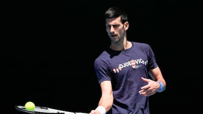 Defending men's champion Serbia's Novak Djokovic practices on Rod Laver Arena ahead of the Australian Open, which begins on January 12. AP Photo
