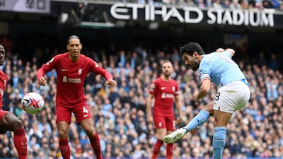 Ilkay Gundogan scores Manchester City's third goal against Liverpool on Saturday. Getty