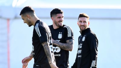 Leandro Paredes, Rodrigo De Paul and Lionel Messi during training. Getty