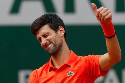 Serbia's Novak Djokovic flashes a thumbs up as he celebrates winning his first round match. Pavel Golovkin / AP Photo