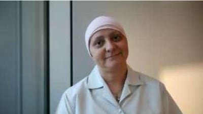 Brigitte Chemla, a breast cancer survivor, believes doctors need to be more direct with patients and more open about available treatments.