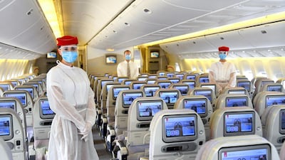 Emirates crew will wear personal protective equipment on all flights, while passengers must wear face masks and gloves for the entire duration of the flight. Courtesy Emirates