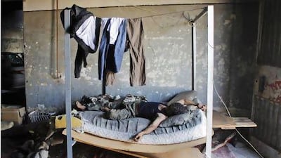 A Free Syrian Army fighter rests in a safe house in Aleppo.