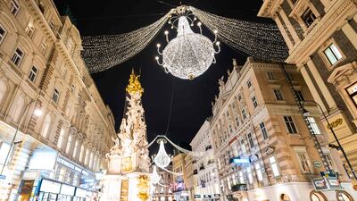 People walk under Christmas lights in Vienna. Austria will enter a national lockdown from November 22, with tourists banned from entry until at least December 13. AFP