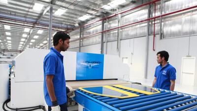 Payroll numbers in the non-oil private sector rose last month, slightly higher than April’s. Sarah Dea / The National