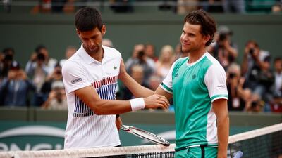 Novak Djokovic, left, was roundly beaten by up-and-coming Dominic Thiem. Adam Pretty / Getty Images