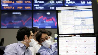 Currency traders work at the foreign exchange dealing room of the KEB Hana Bank headquarters in Seoul, South Korea. AP Photo