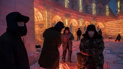 Chinese workers gather lights that will be placed inside ice sculptures in preparation for the Harbin Ice and Snow Festival in Harbin, China. Getty Images