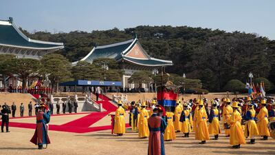 Sheikh Mohamed bin Zayed and South Korea President Moon Jae-in stand for a photograph during a reception at Blue House. Ryan Carter / Ministry of Presidential Affairs