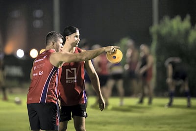 Jebel Ali Dragons coach Henry Paul, left, passes on instructions to James Love during a training session. Reem Mohammed / The National