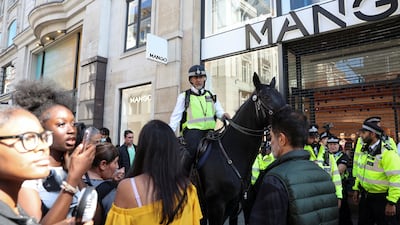 Mounted police officers outside a shop on Oxford Street. Reuters
