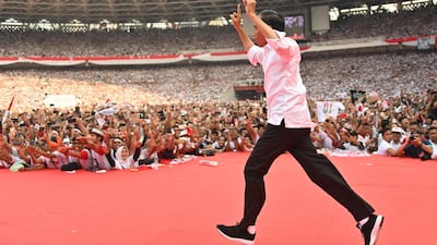 Incumbent Indonesian President Joko Widodo arrives onstage for an election rally on the final day of campaigning in Jakarta on April 13, 2019. AFP