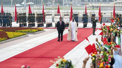 Sheikh Mohamed bin Zayed, Crown Prince of Abu Dhabi and Deputy Supreme Commander of the Armed Forces (2nd L), attends a reception hosted by Xi Jinping, President of China (L), at the Great Hall of the People in Beijing, China on July 22, 2019. Mohamed Al Hammadi / Ministry of Presidential Affairs