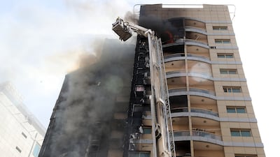 Fire broke out at a residential building in the Al Barsha area of Dubai on Friday. All photos: Pawan Singh / The National