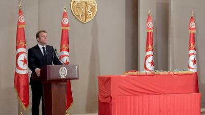 French President Emmanuel Macron speaks during the state funeral of late president Essebsi at the presidential palace in the capital's eastern suburb of Carthage. AFP