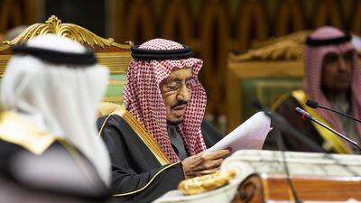 King Salman bin Abdulaziz reads notes. AFP / Saudi Royal Palace