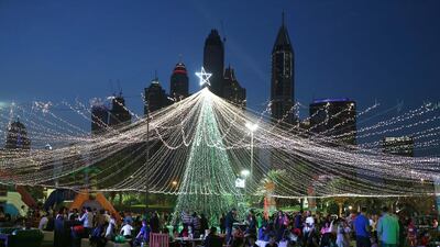 People enjoy Christmas activities at the Emirates Golf Club in Dubai. Pawan Singh / The National